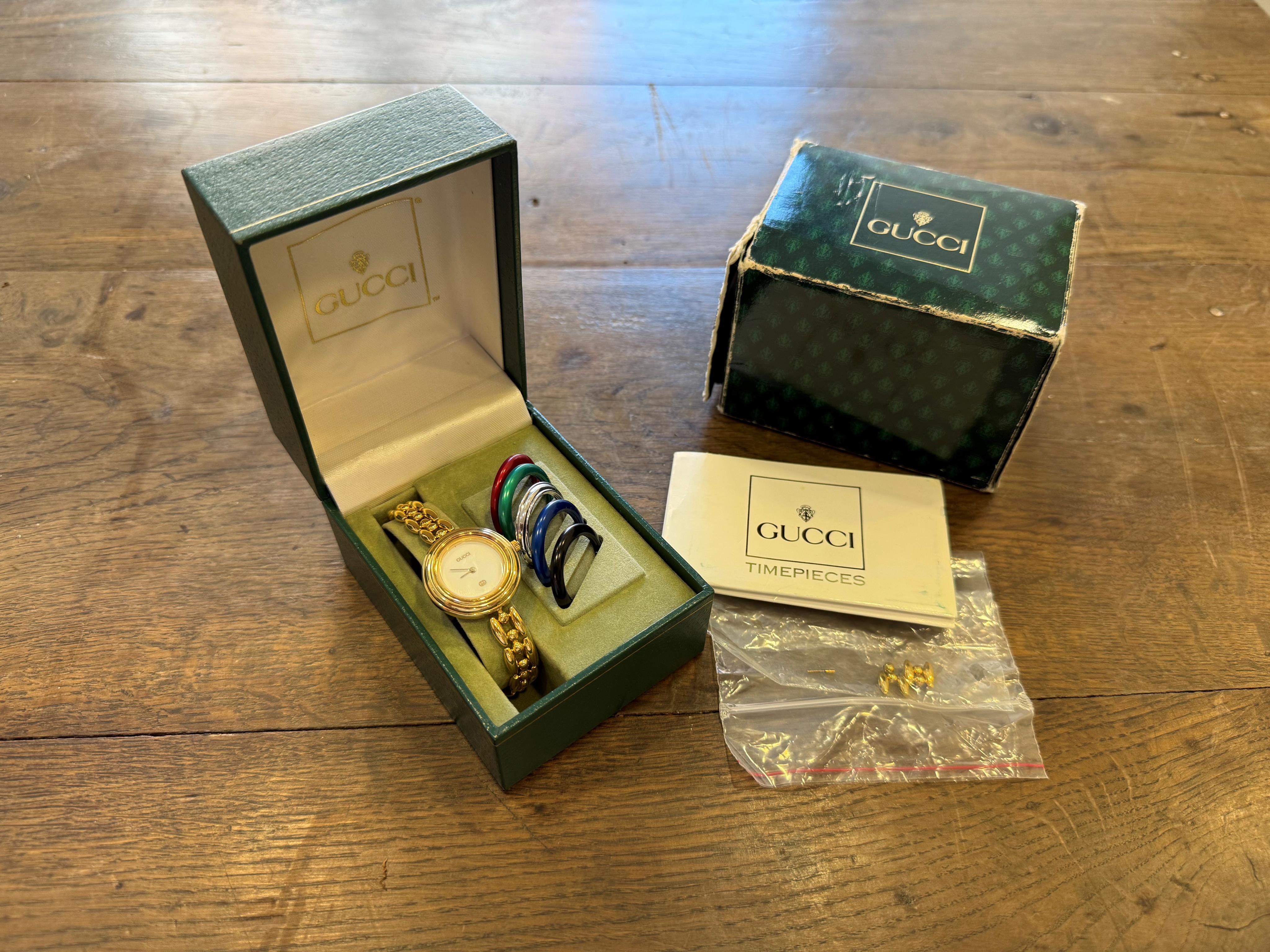 A Gucci 11/12 ladies gold plated watch, boxed